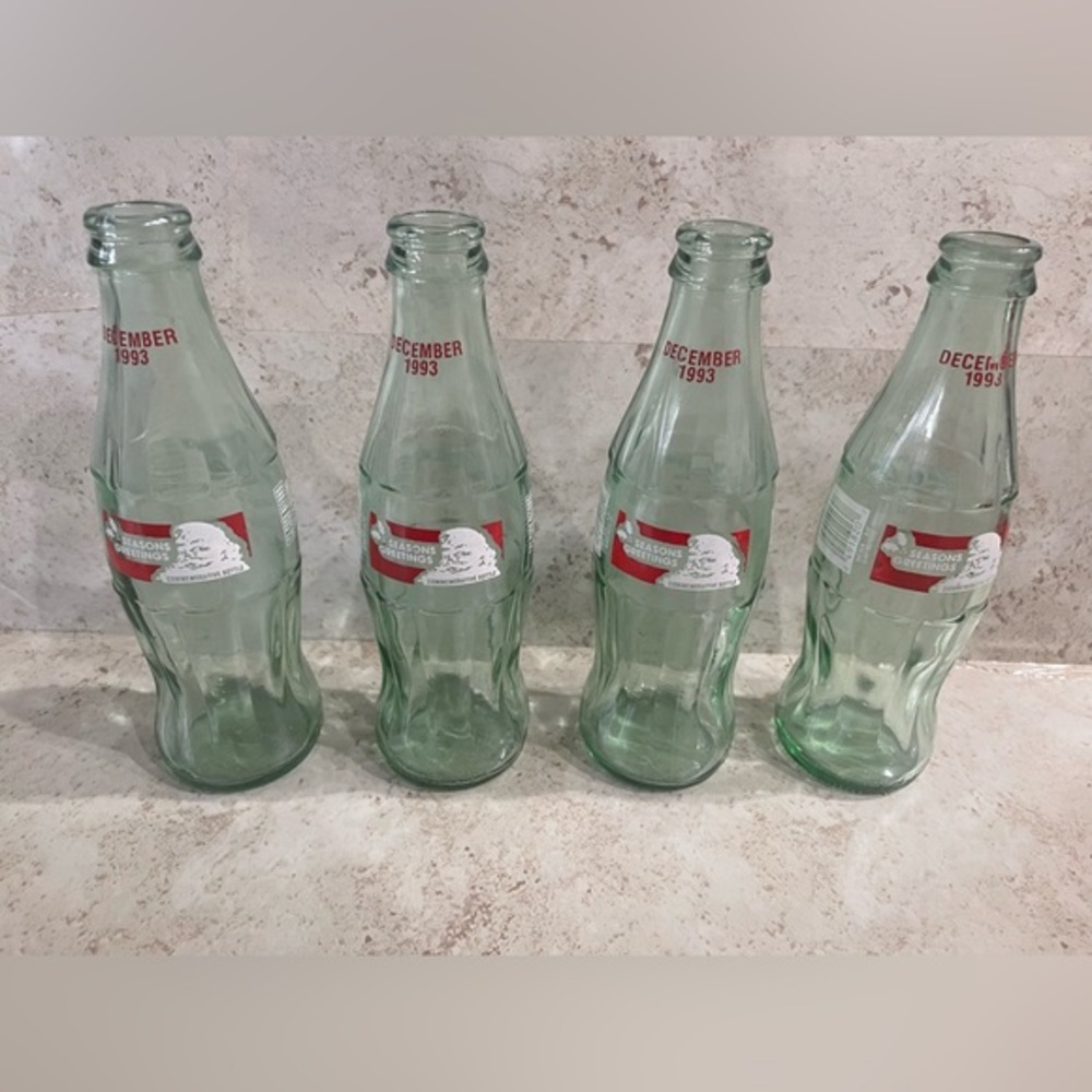 Coca Cola set of 4 bottles -8oz-  Season Greetings- December 1993